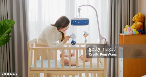 cute newborn baby in crib - moms crying in bed stock pictures, royalty-free photos & images