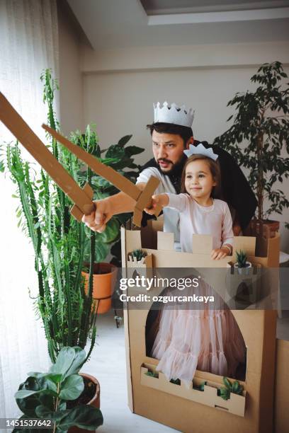 father playing exciting adventure game with daughter - fairy princess stock pictures, royalty-free photos & images