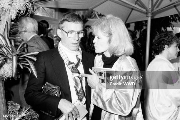 Roddy McDowall and Angie Dickinson attend a party in Beverly Hills, California, on June 25, 1987.