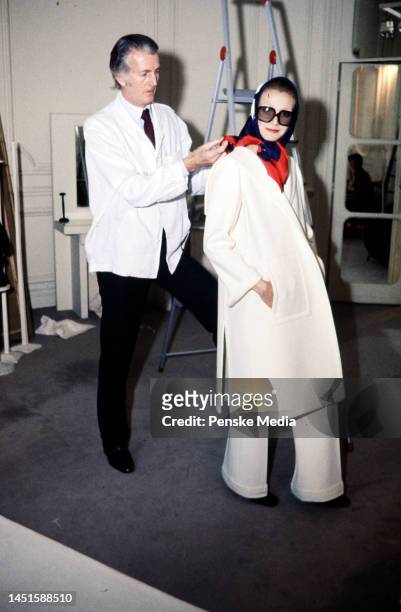 Designer Hubert de Givenchy with a model
