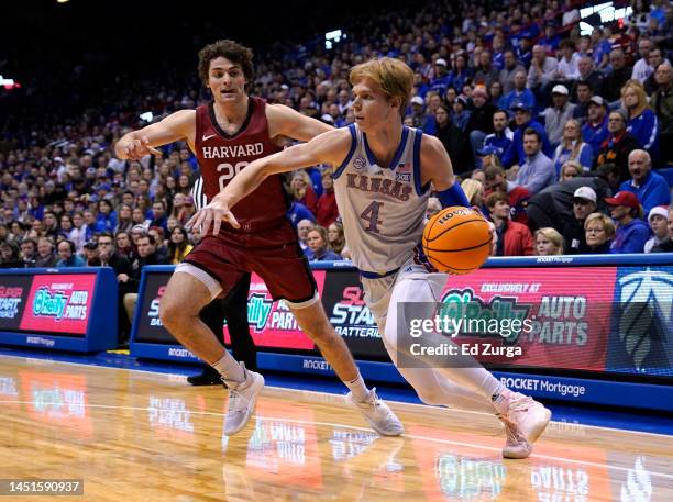 Gradey Dick of the Kansas Jayhawks drives to the basket against Sam Silverstein of the Harvard Crimson in the first half at Allen Fieldhouse on...