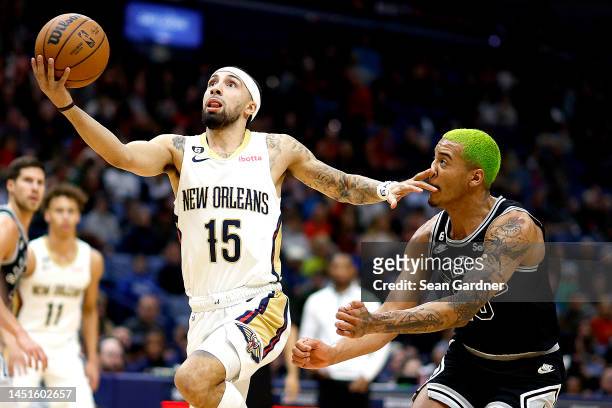 Jose Alvarado of the New Orleans Pelicans shoots over Jeremy Sochan of the San Antonio Spurs during the first quarter of an NBA game at Smoothie King...