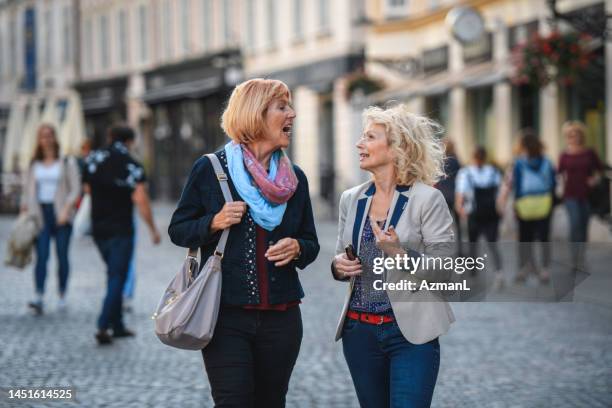 beautiful senior caucasian women meet for a coffee - fashionable grandma stock pictures, royalty-free photos & images