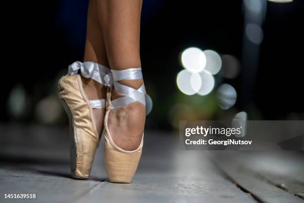 the beauty of classical ballet on the city streets at night. - kid actor stock pictures, royalty-free photos & images