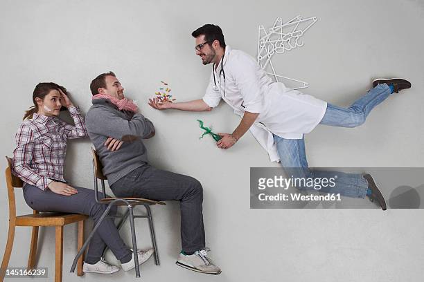 doctor giving medicine to sick patient - touched by an angel stockfoto's en -beelden