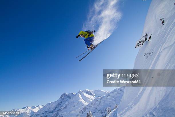 austria, arlberg, warth, mid adult man skiing - ski jumper stock pictures, royalty-free photos & images