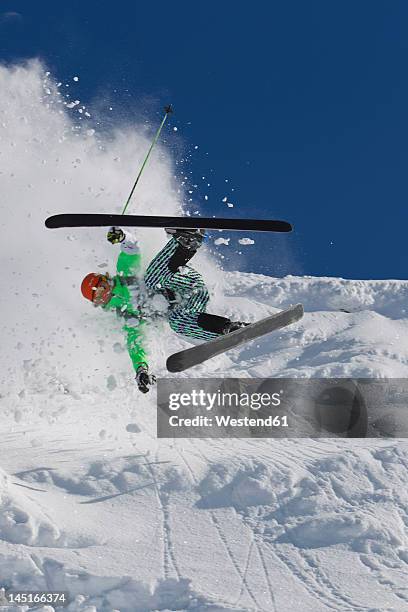 austria, tyrol, kitzbuhel, mid adult man crash while skiing - kitzbuhel stock pictures, royalty-free photos & images