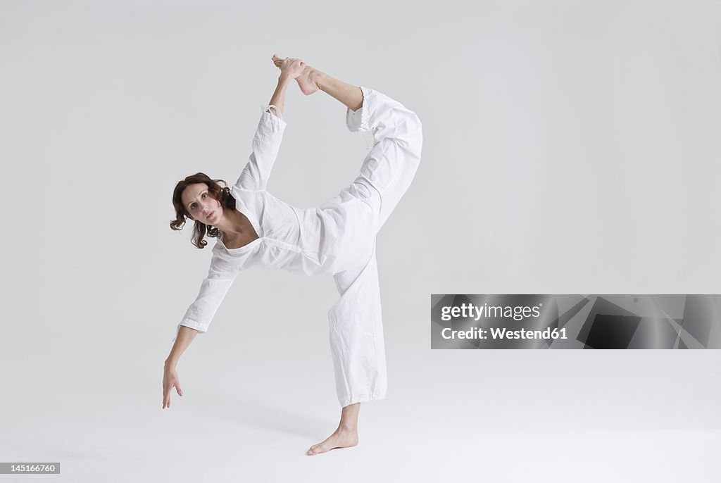 Mid adult woman doing exercise