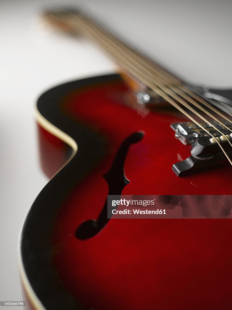 Guitar on white background, close up