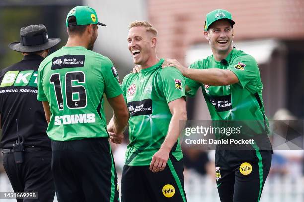 Luke Wood of the Stars celebrates with Marcus Stoinis of the Stars and Beau Webster of the Stars after taking the final wicket to dismiss Jhye...