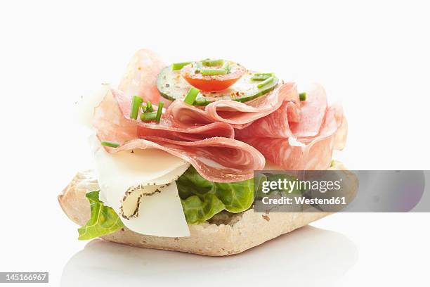 bread roll with salami, cheese, tomatoes, lettuce on white background - sliced ham stock pictures, royalty-free photos & images