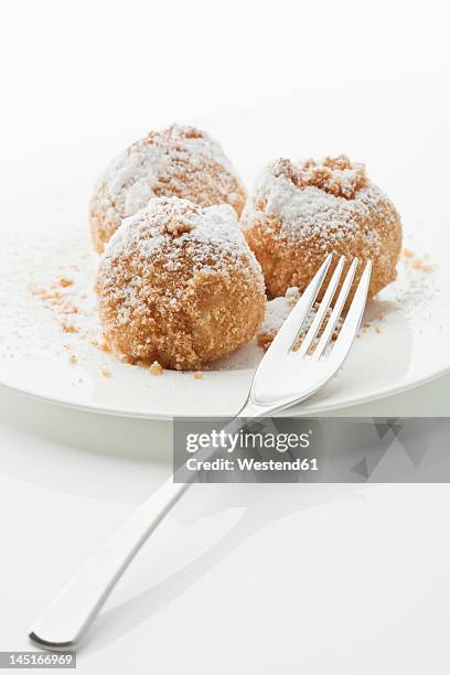 apricot dumpling in plate on white background - kloß stock-fotos und bilder