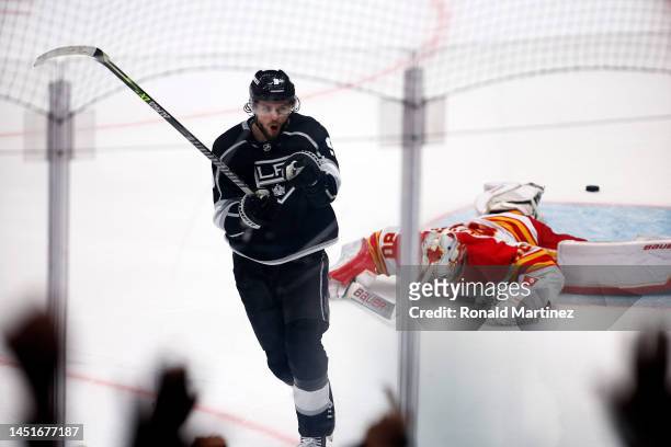 Adrian Kempe of the Los Angeles Kings celebrates the game winning goal against Dan Vladar of the Calgary Flames in overtime at Crypto.com Arena on...