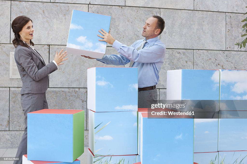 Germany, Leipzig, Business people with cubes