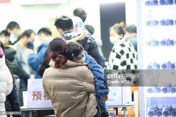 Patients wait to see the doctors at a fever clinic of Dongguan People's Hospital on December 20, 2022 in Dongguan, Guangdong Province of China.