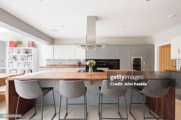 property kitchen interiors - kitchen island stock pictures, royalty-free photos & images