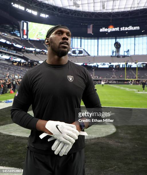 Defensive end Chandler Jones of the Las Vegas Raiders talks to fans before a game against the New England Patriots at Allegiant Stadium on December...