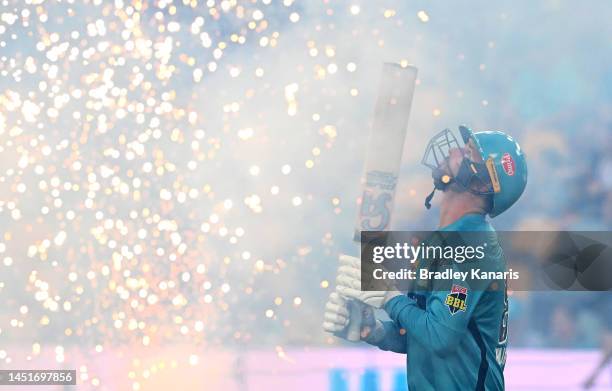 Colin Munro of the Heat enters the field of play to open the batting during the Men's Big Bash League match between the Brisbane Heat and the...