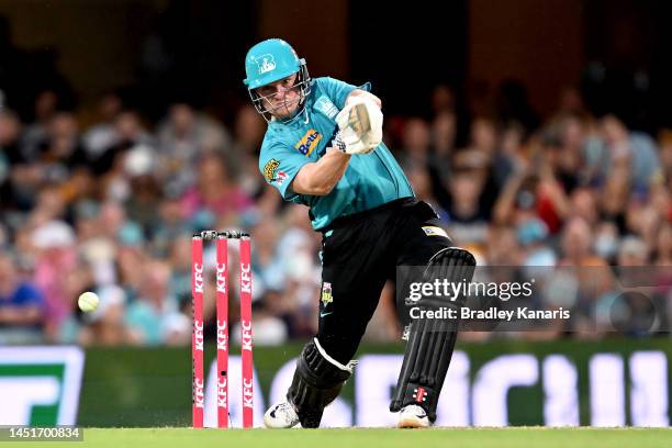 Max Bryant of the Heat hits the ball to the boundary for a four during the Men's Big Bash League match between the Brisbane Heat and the Adelaide...