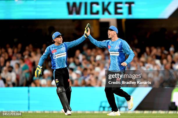 Jake Weatherald of the Strikers celebrates after taking the catch to dismiss Jimmy Peirson of the Heat during the Men's Big Bash League match between...