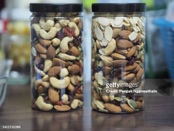 cashew nuts, nuts, grains in plastic jars - canned cranberry stock pictures, royalty-free photos & images