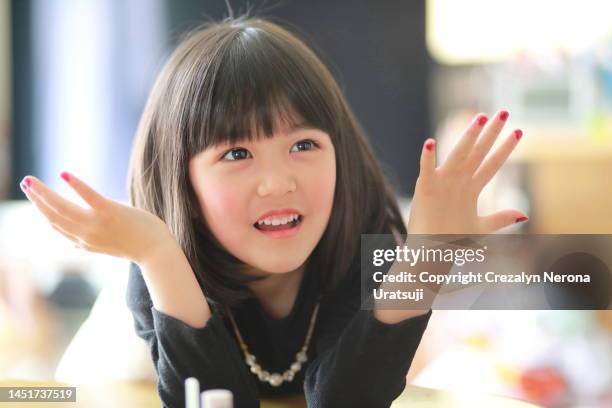 little child happy with manicure - cute kawaii faces photos et images de collection