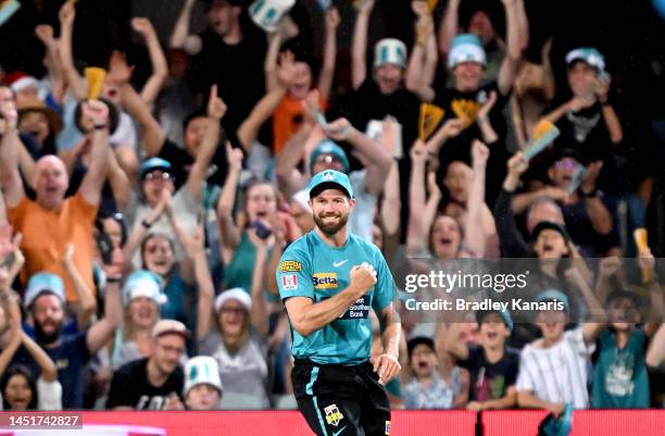 Michael Neser of the Heat celebrates after taking the catch to dismiss Harry Nielsen of the Strikers during the Men's Big Bash League match between...