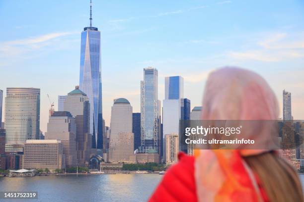 pretty  active women long blonde hair enjoying  in  panorama of new york city skyline lower manhattan - new york city marathon stock pictures, royalty-free photos & images