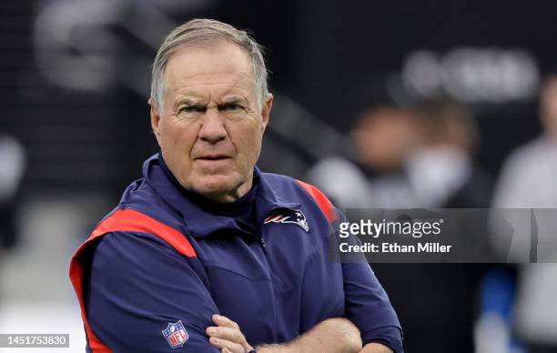 Head coach Bill Belichick of the New England Patriots watches his players warm up before a game against the Las Vegas Raiders at Allegiant Stadium on...