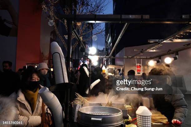 Street vender is seen at the Myeongdong shopping district, two days ahead of Christmas on December 23, 2022 in Seoul, South Korea. Central Seoul’s...