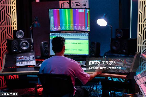 man working in professional music studio - broadcast control room stock pictures, royalty-free photos & images