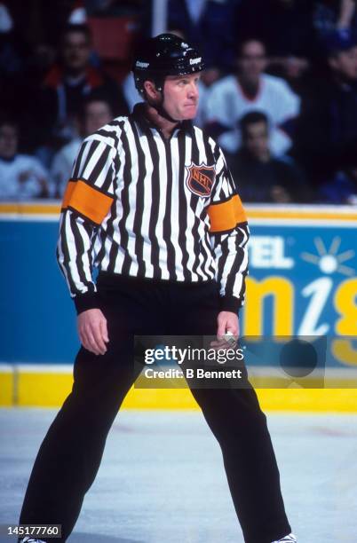 Referee Terry Gregson follows the play during an NHL game with the Winnipeg Jets in March, 1995 at the Winnipeg Arena in Winnipeg, Manitoba, Canada.