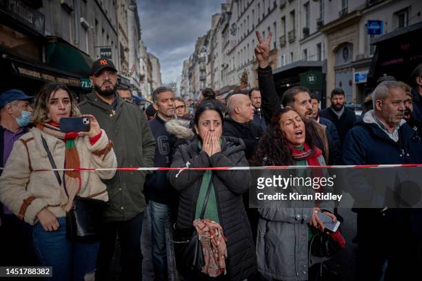 The local community watch and react at the scene of a fatal shooting in the multi-cultural neighbourhood of Strasbourg-Saint Denis in Paris which...