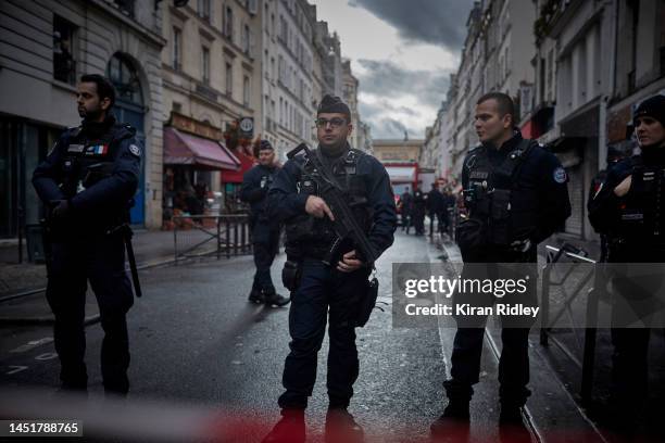 Armed police seal off the scene of a fatal shooting which left three dead and several people injured in the multi-cultural neighbourhood of...