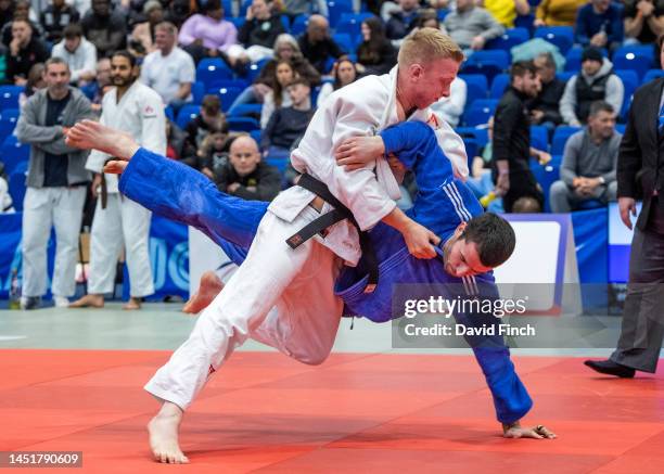 Harry Le Mare of Camberley JC throws Callum Maclennan of Edinburgh JC for a wazari in 'Golden Score' extra time to win their u73kg repechage contest...