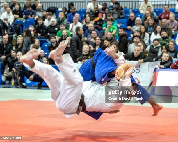 Scottish Open champion, Michael Fryer of Rush JC throws Finlay Allan of Camberley JC with a floating hip throw in extra-time to score a wazari and...