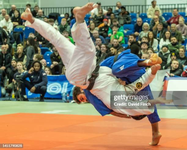 Scottish Open champion, Michael Fryer of Rush JC throws Finlay Allan of Camberley JC with a floating hip throw in extra-time to score a wazari and...