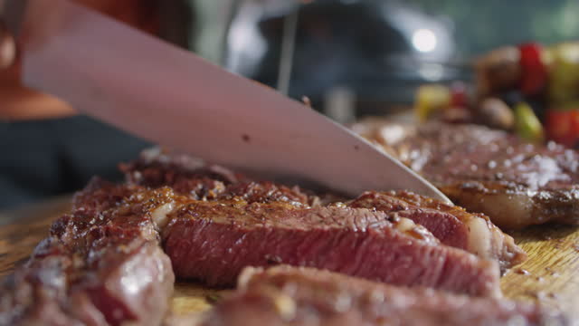 Cutting Grilled Beef Steak
