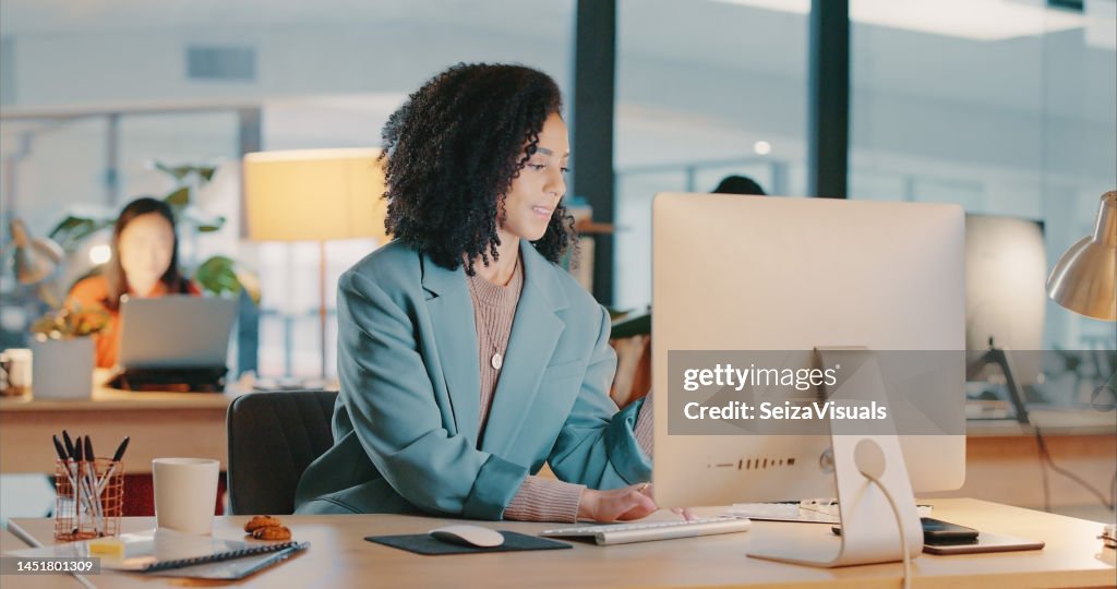 Business black woman, computer and office desk at a digital marketing agency typing, writing or research copywriting strategy. Editor, design and corporate woman editing on desktop on company website