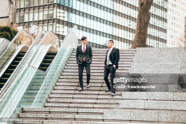 business man commuter walking to work - suspicion employee stock pictures, royalty-free photos & images