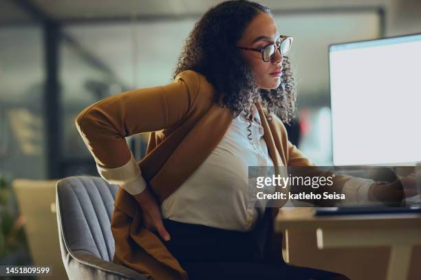 backache, business woman and computer research at night in office with burnout, stress and spine, discomfort and mockup. back pain, black woman and posture problem while working late on deadline - back pain woman stock pictures, royalty-free photos & images