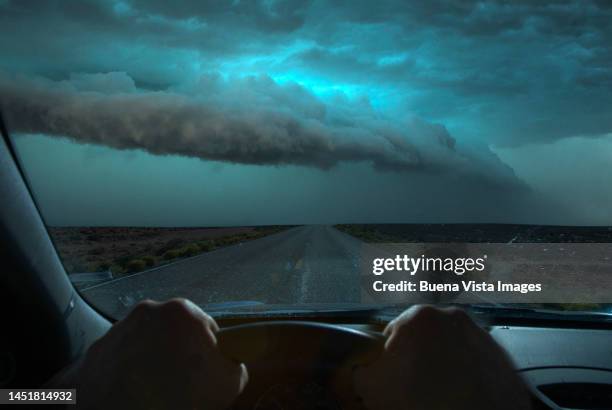 thunderstorm over a road in the desert - city street stock pictures, royalty-free photos & images