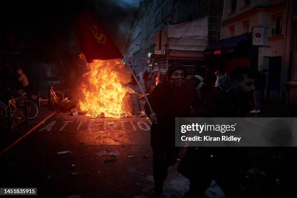 Angry protestors face off towards French Riot Police after violent clashes broke out after the visit of the French Interior Minister Gerald Darmanin...