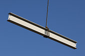 Steel girder wrapped in a giant hanging in the air