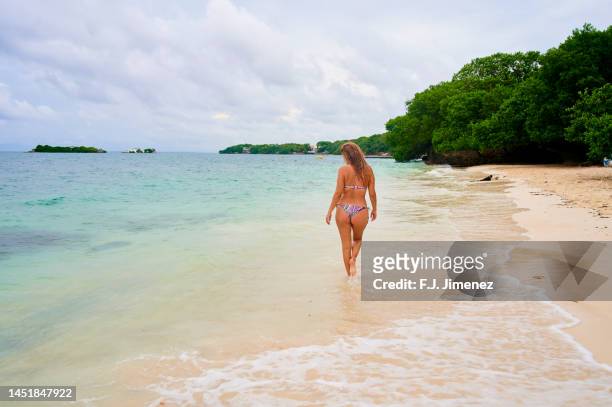 woman in beach of colombian caribbean island - cartagena colombia stock pictures, royalty-free photos & images