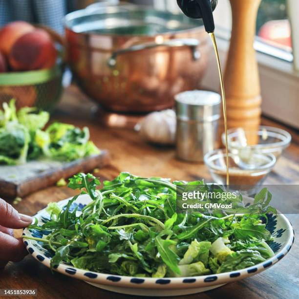 preparing steak with arugula peach salad - arugula stock pictures, royalty-free photos & images