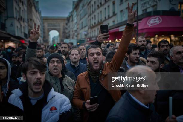 Angry protestors, mainly from the Kurdish local community, shout and chant during the visit of the French Interior Minister Gerald Darmanin to the...