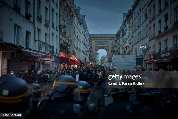 Angry protestors face French Riot Police as violence broke out after the visit of the French Interior Minister Gerald Darmanin to the scene of a...
