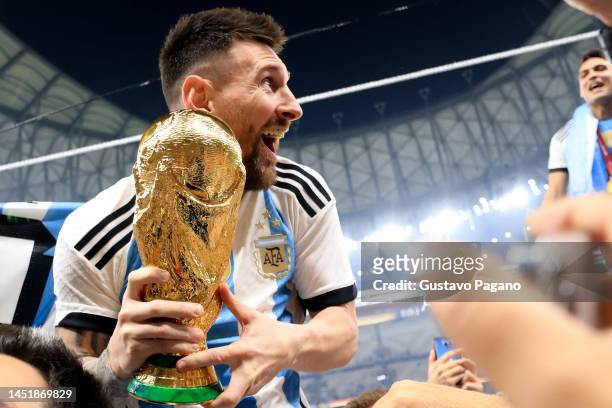 Lionel Messi of Argentina celebrates with the FIFA World Cup Qatar 2022 Winner's Trophy after winning the FIFA World Cup Qatar 2022 Final match...