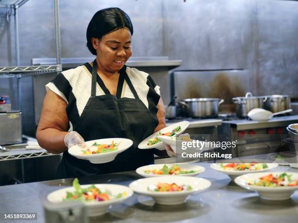 working in a commercial kitchen - catering black uniform stock pictures, royalty-free photos & images